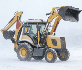 Máy xúc lật tỏa sáng trong khung cảnh tuyết mùa đông.